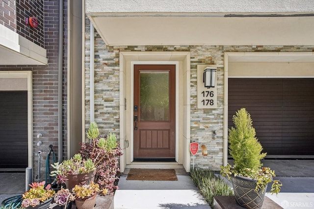 176 Summit Way, San Francisco, CA 94132 - property entrance featuring stone siding, brick siding, and a garage