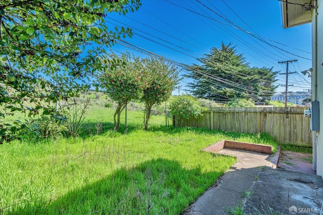 view of yard with a fenced backyard