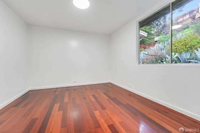 spare room featuring hardwood / wood-style flooring