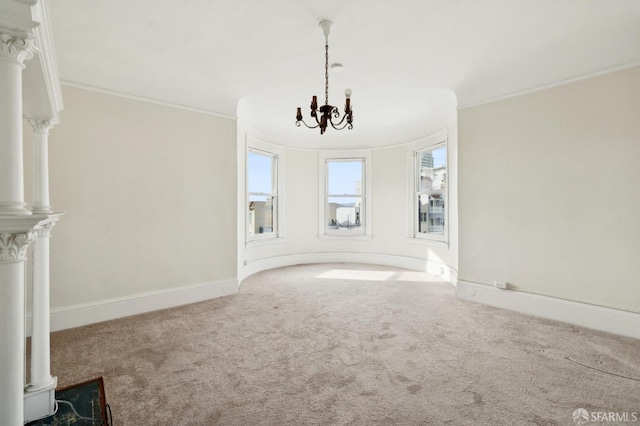 unfurnished living room featuring baseboards, carpet, a notable chandelier, and crown molding