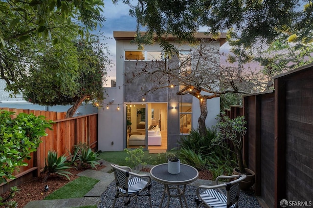 back of property with a fenced backyard