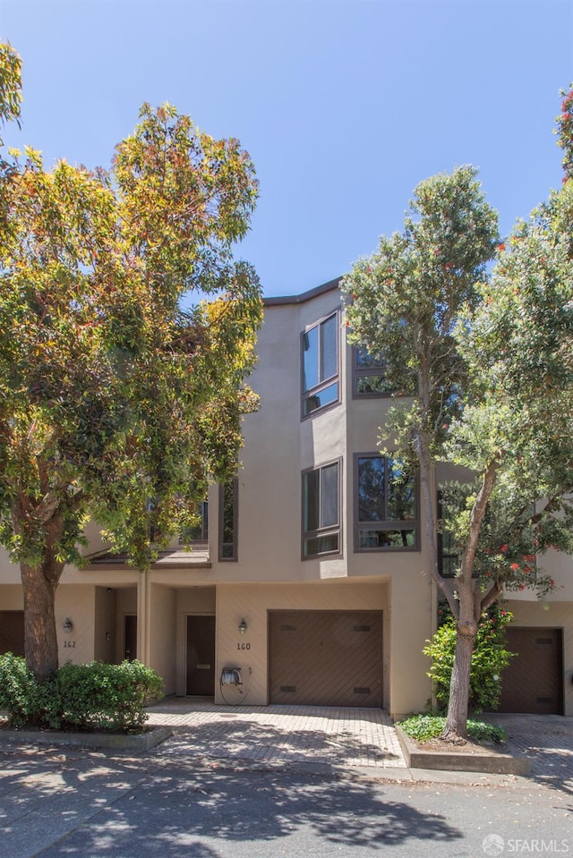 160 S Lake Merced Hls, San Francisco, CA 94132 - view of building exterior featuring an attached garage and driveway