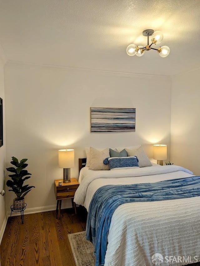 192 Ridgeway Ave, Oakland, CA 94611 - bedroom featuring wood finished floors, a chandelier, and crown molding