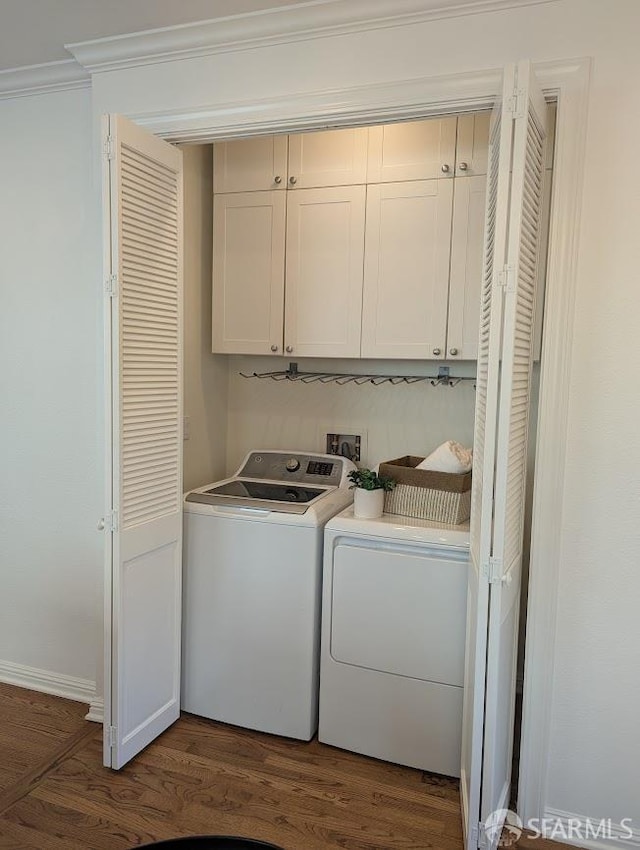 192 Ridgeway Ave, Oakland, CA 94611 - laundry room featuring cabinet space, washer and dryer, dark wood finished floors, and crown molding