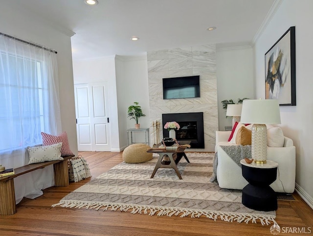 192 Ridgeway Ave, Oakland, CA 94611 - living area with crown molding, wood finished floors, a high end fireplace, and recessed lighting