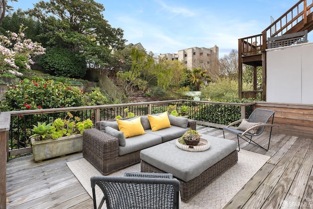 wooden deck with an outdoor hangout area