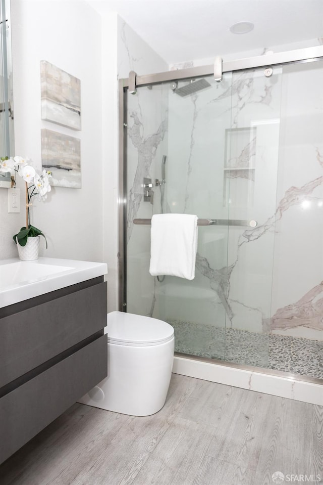 28290 Thackeray Ave, Hayward, CA 94544 - full bathroom with wood finished floors, vanity, a marble finish shower, and toilet