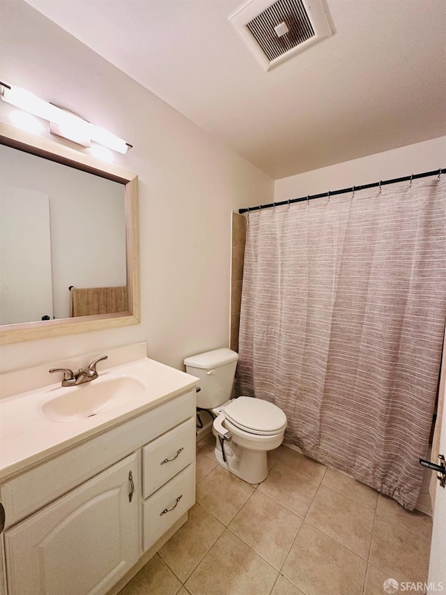 bathroom featuring vanity, tile patterned flooring, toilet, and a shower with shower curtain