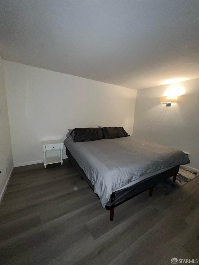 bedroom with pool table and dark hardwood / wood-style floors