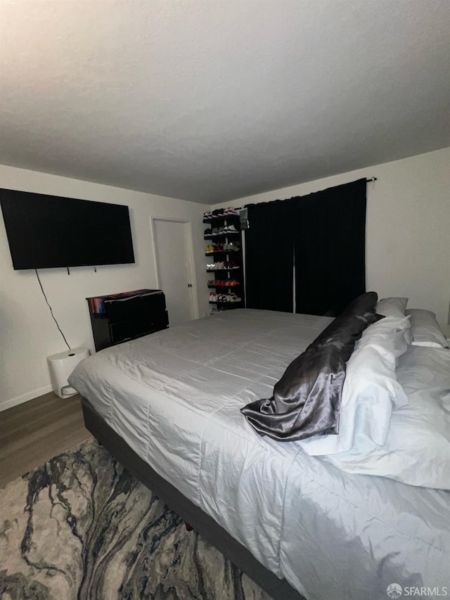 bedroom with wood-type flooring