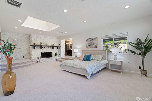 350 Camino Diablo Rd, Brentwood, CA 94513 - carpeted bedroom featuring a fireplace, a skylight, visible vents, and recessed lighting