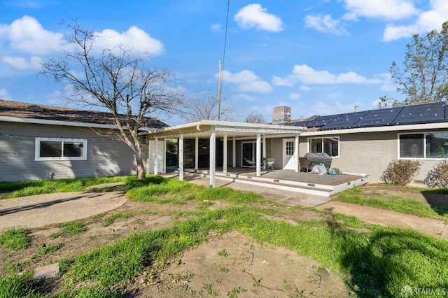 350 Camino Diablo Rd, Brentwood, CA 94513 - back of property with a chimney, a patio area, and roof mounted solar panels