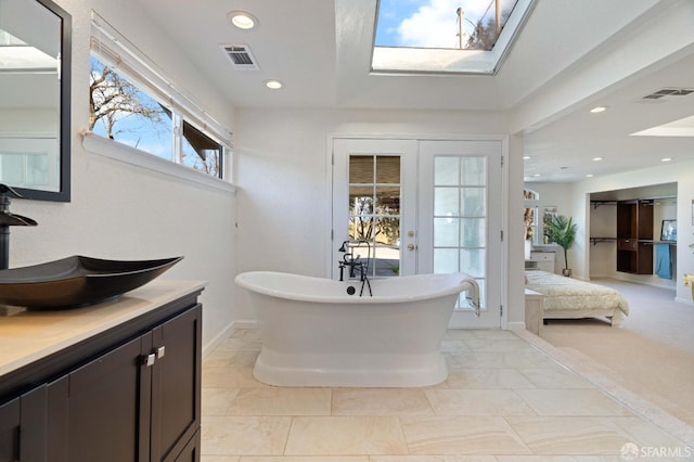 350 Camino Diablo Rd, Brentwood, CA 94513 - bathroom with a soaking tub, connected bathroom, visible vents, and a skylight