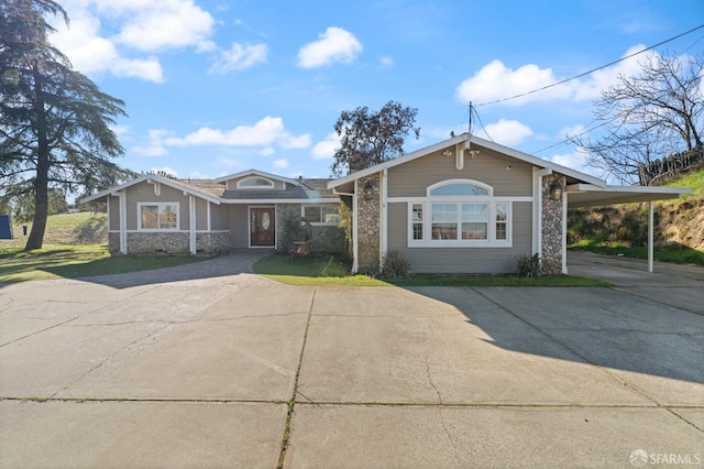 350 Camino Diablo Rd, Brentwood, CA 94513 - view of front of home featuring concrete driveway, stone siding, an attached carport, and a front lawn