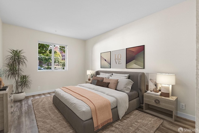 bedroom featuring dark hardwood / wood-style flooring