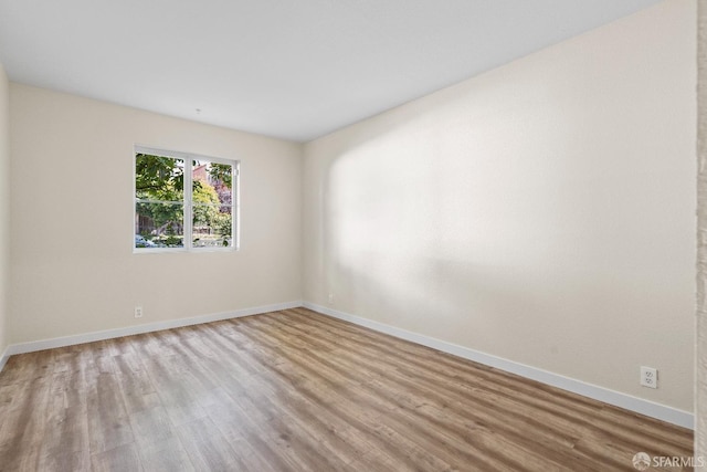 spare room featuring light hardwood / wood-style flooring