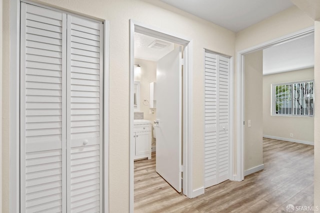 hall featuring light hardwood / wood-style floors