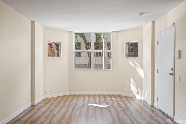 spare room with light hardwood / wood-style flooring