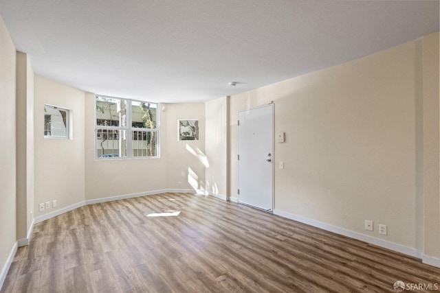 empty room featuring hardwood / wood-style floors