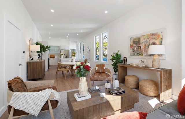 living room featuring recessed lighting and light wood-style floors