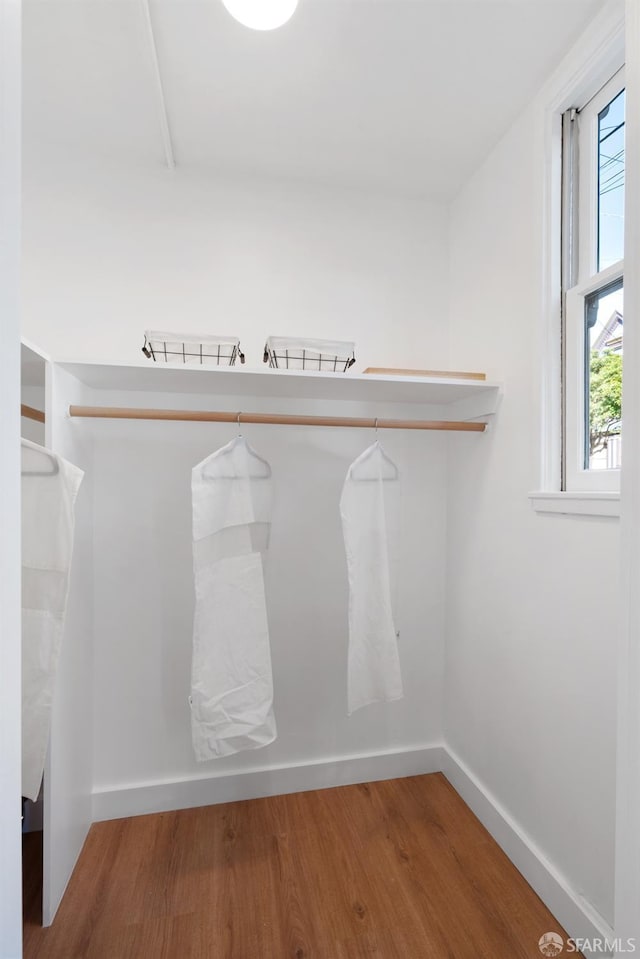 spacious closet with wood finished floors