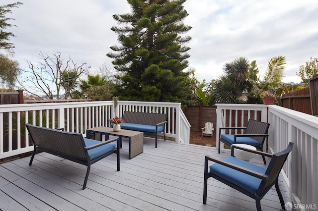 wooden deck with an outdoor hangout area