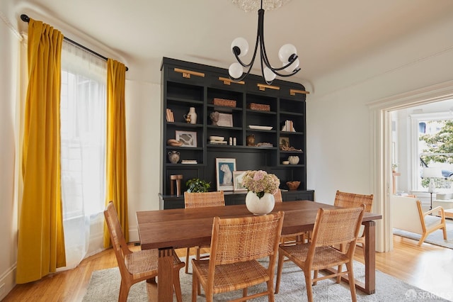 dining room featuring a chandelier and hardwood / wood-style floors