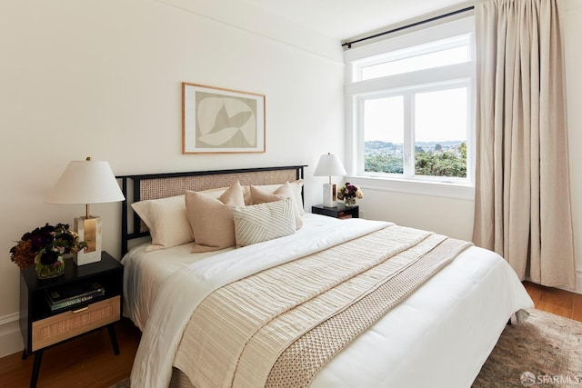 bedroom with wood-type flooring