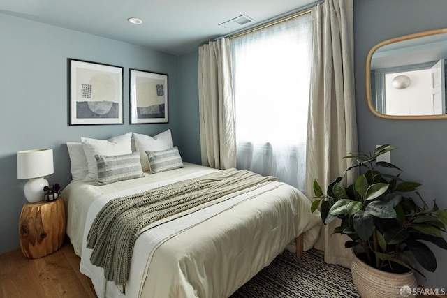 bedroom featuring hardwood / wood-style floors