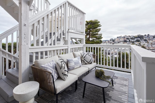 wooden terrace featuring outdoor lounge area