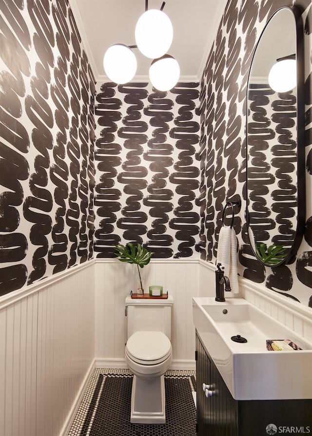 bathroom featuring vanity, tile patterned floors, and toilet