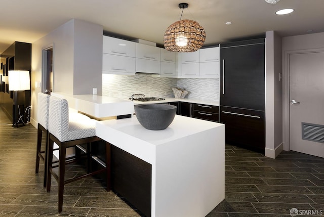420 Mission Bay Blvd Unit 706, San Francisco, CA 94158 - kitchen featuring light countertops, white cabinetry, built in refrigerator, and dark wood finished floors