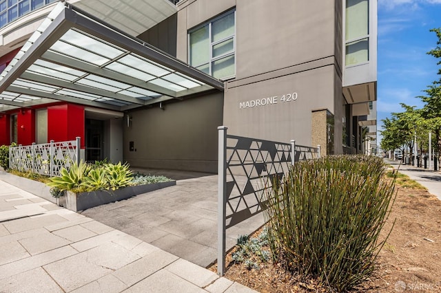 420 Mission Bay Blvd Unit 706, San Francisco, CA 94158 - view of exterior entry with fence and stucco siding
