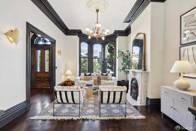 sitting room with an inviting chandelier, ornamental molding, and a healthy amount of sunlight