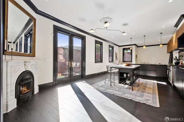 dining room featuring crown molding, dark hardwood / wood-style floors, and french doors