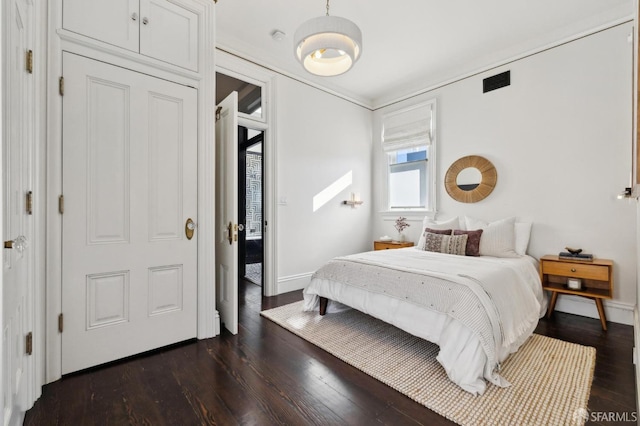 bedroom featuring dark wood-type flooring