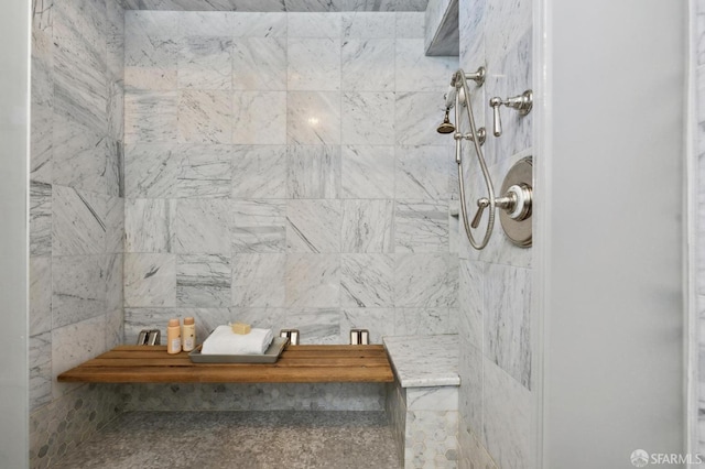 bathroom featuring tiled shower