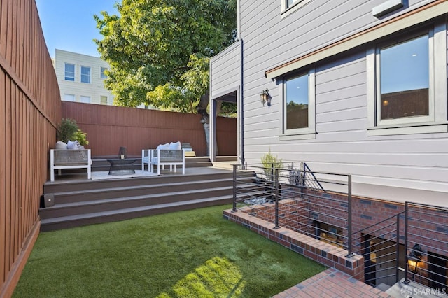 view of yard featuring outdoor lounge area and a deck