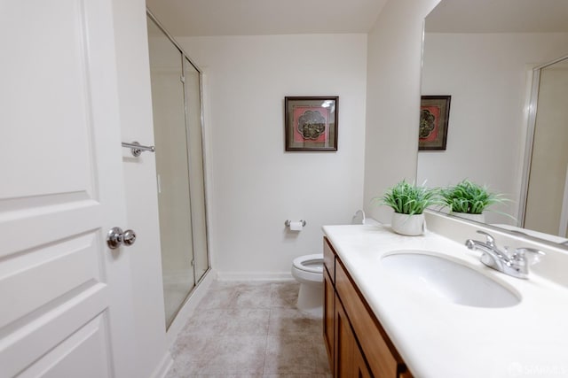 bathroom featuring vanity, tile patterned flooring, a shower with door, and toilet