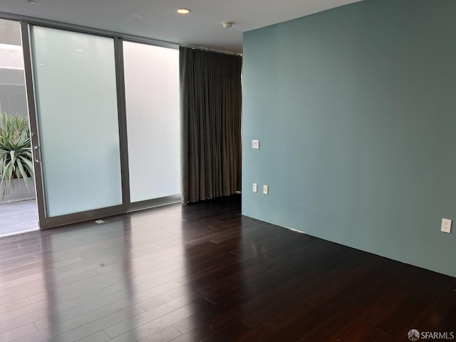 unfurnished room featuring hardwood / wood-style floors