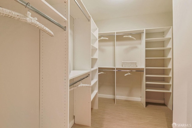 spacious closet with wood finished floors