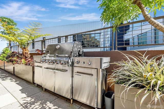 view of patio / terrace featuring exterior kitchen and grilling area
