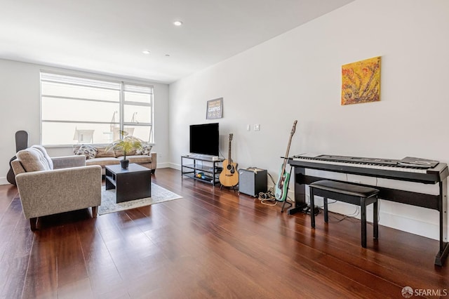 living area featuring wood finished floors and recessed lighting