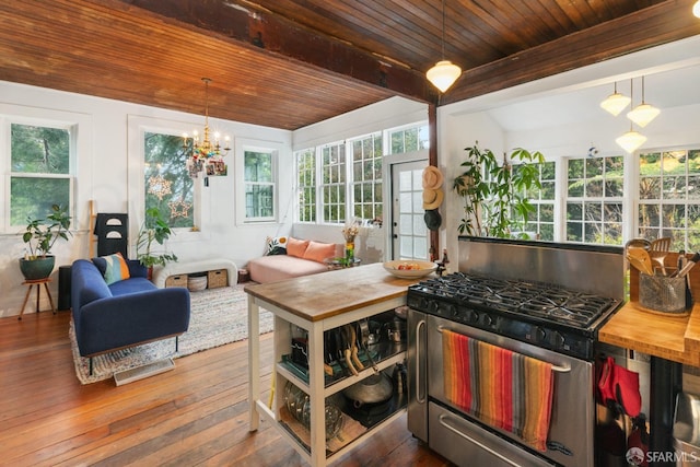 sunroom / solarium with beamed ceiling and a chandelier