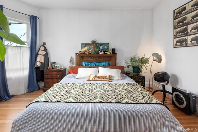 bedroom with light hardwood / wood-style floors