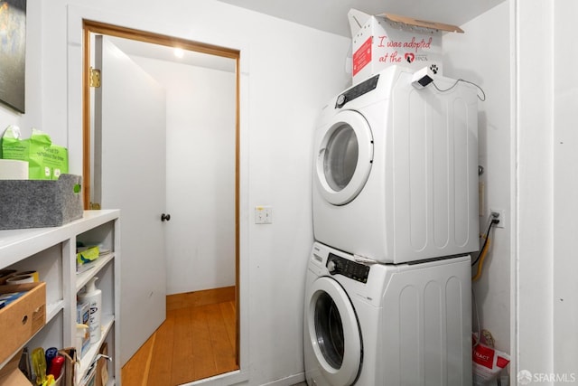 washroom with stacked washer / drying machine