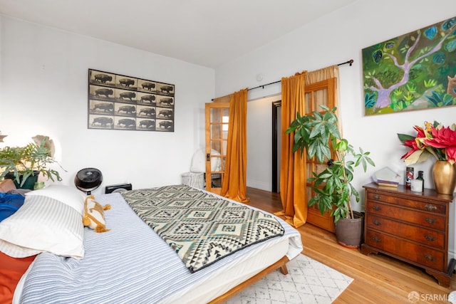 bedroom with light wood-type flooring