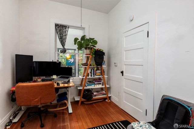 home office with wood-type flooring