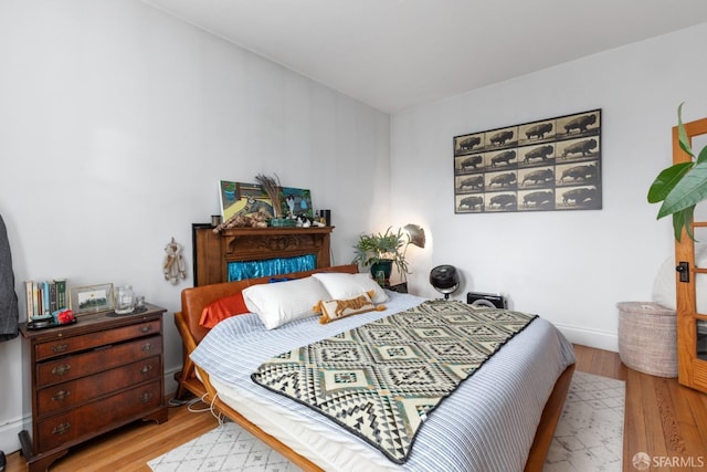 bedroom with light wood-type flooring