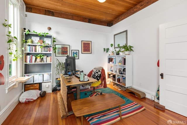 office space featuring hardwood / wood-style flooring, plenty of natural light, and wooden ceiling